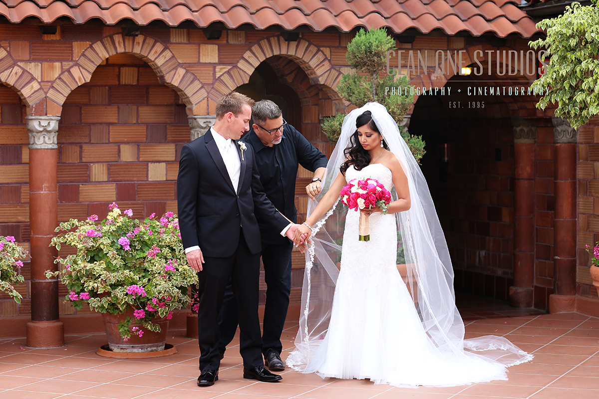 Photographer fixing brides veil | Cean One Photography | San Diego Wedding Photographer